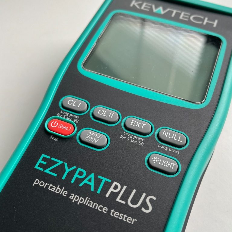 Kewtech PAT Tester EZYPATPLUS A KEWTECH EZYPAT PLUS portable appliance tester with buttons and a display screen.